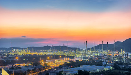 Fototapeta na wymiar Oil refinery industry at Hightlight of Sunset scenery