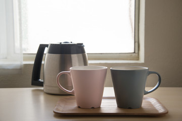 pair of mug and coffee pot