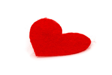 Fototapeta premium red heart made of felt inclined on a white background