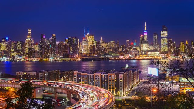 New York City skyline time lapse over The Helix Loop and the Hudson River.