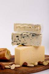 Still-life cheese platter on white background