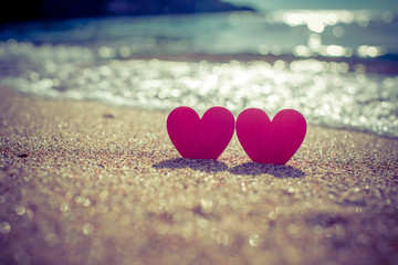 romantic symbol of two hearts on the beach 