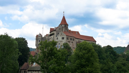 Fototapeta na wymiar Pernstejn Castle is a castle on a rock above the village of Nedvedice some 40 kilometres 25 mi northwest of Brno, in the South Moravian Region, Czech Republic. 