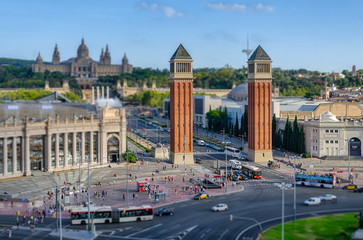 Clear Venetian towers on fuzzy background of placa Espanya in Barcelona, Spain