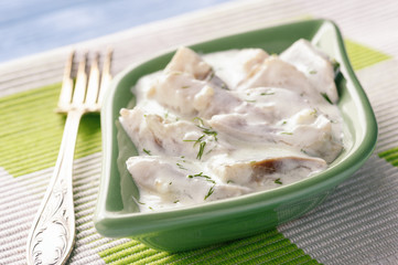 Herring in sour cream sauce with dill.