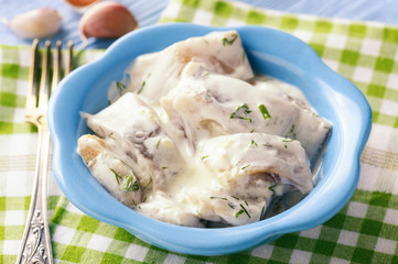 Herring in sour cream sauce with dill.