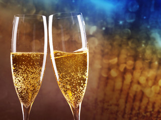 toasting with champagne glasses against holiday lights