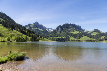 Fototapeta na wymiar Black lake in Switzerland