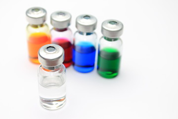 Medical background with five vials of colored medicine 