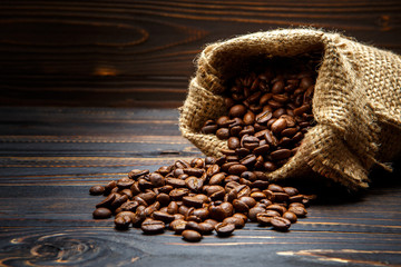 roasted coffee beans on wooden background