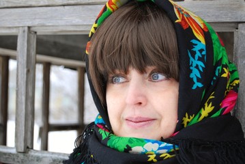 a woman in a colorful headscarf