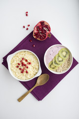 Bowl of oats porridge isolated on a white background