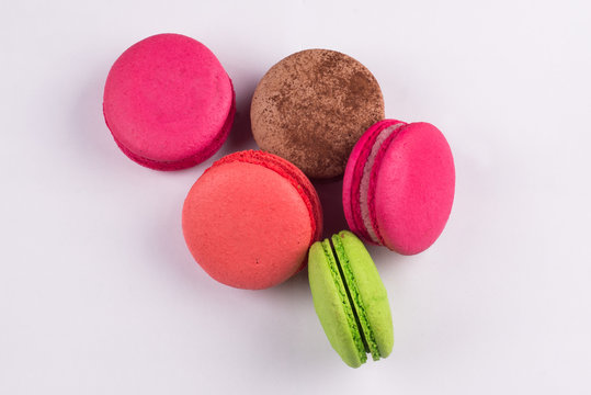 Macaroons for dessert on a white background.