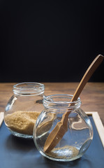 Wooden spoon in glass jar