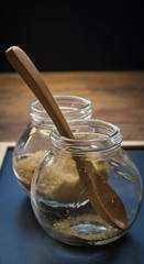 Wooden spoon in glass jar
