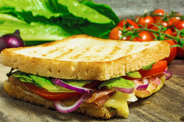 sandwich toast grilled with bacon,cheese and tomatoes