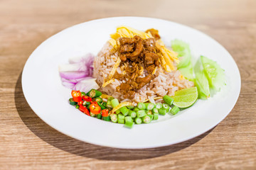 Thai food, Rice seasoned with shrimp paste in white plate on the