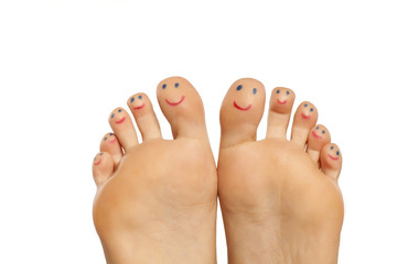 female foot and smiles drawn on the toes - obrazy, fototapety, plakaty