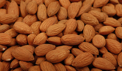 Raw whole almond nuts close up