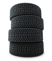 Stack of automobile winter tires isolated on white background.