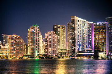 Beautiful Miami Florida skyline with lights and bay at night