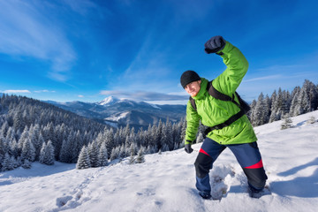 Fototapeta na wymiar Success in the mountains in winter