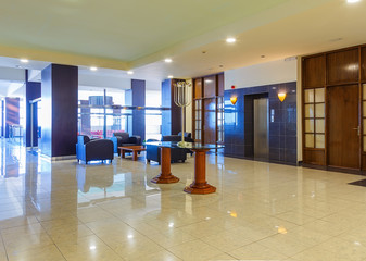 Hall with comfortable sofa in modern hotel