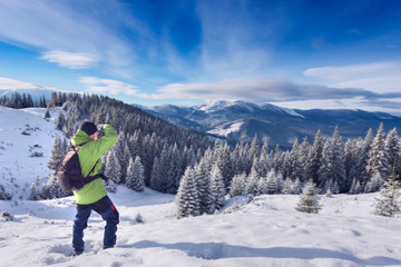 Hiker winter in the mountains