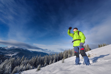 Fototapeta na wymiar Hiker winter in the mountains