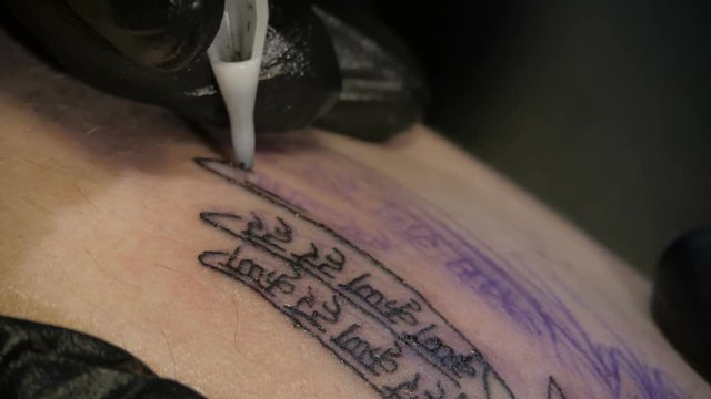 Getting a tattoo. Close-up, toned image