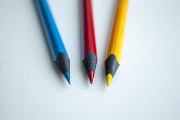 three colored pencil