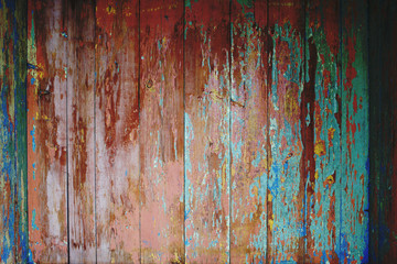 old wooden background with worn and cracked paint from time to time