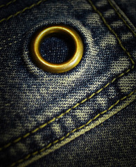 jeans background texture with gold button