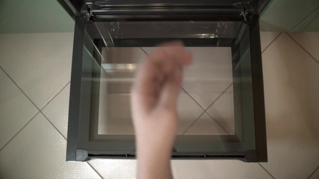 Top view of Baking Gingerbread man in the oven, view from above of the oven. Cooking in the oven. Women posing in the oven for baking cookies