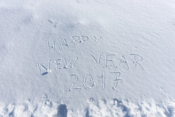 Written words happy new year 2017 in snow