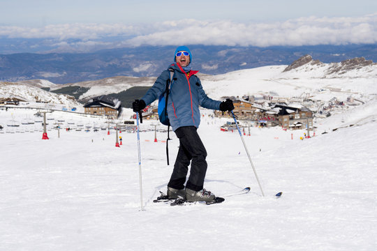 happy man happy in snow mountains at Sierra Nevada ski resort in Spain