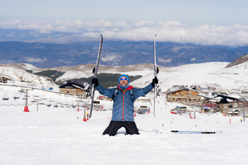 happy man happy in snow mountains at Sierra Nevada ski resort in Spain