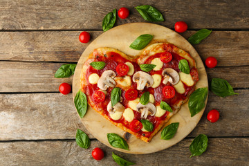 Tasty pizza on cutting board