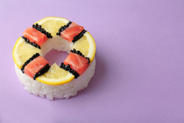 Sushi doughnut on purple background