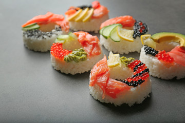 Sushi doughnuts on grey textured background