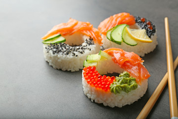 Sushi doughnuts on grey textured background