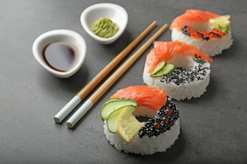 Sushi doughnuts on grey textured background