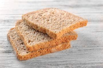 Sliced fresh bread on wooden background