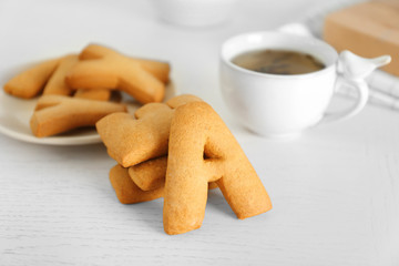 Cookie alphabet and tea on table