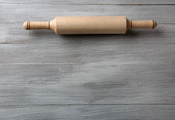 Rolling pin on wooden background