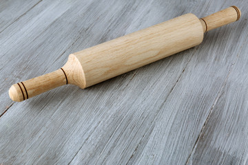 Rolling pin on wooden background