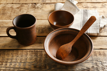 Set of dinnerware on wooden table