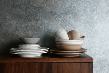 Set of dinnerware on gray background