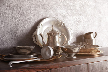 Set of dinnerware on gray background