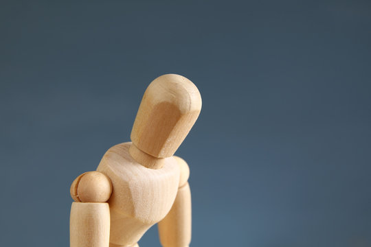 wooden dummy with worried stressed body position